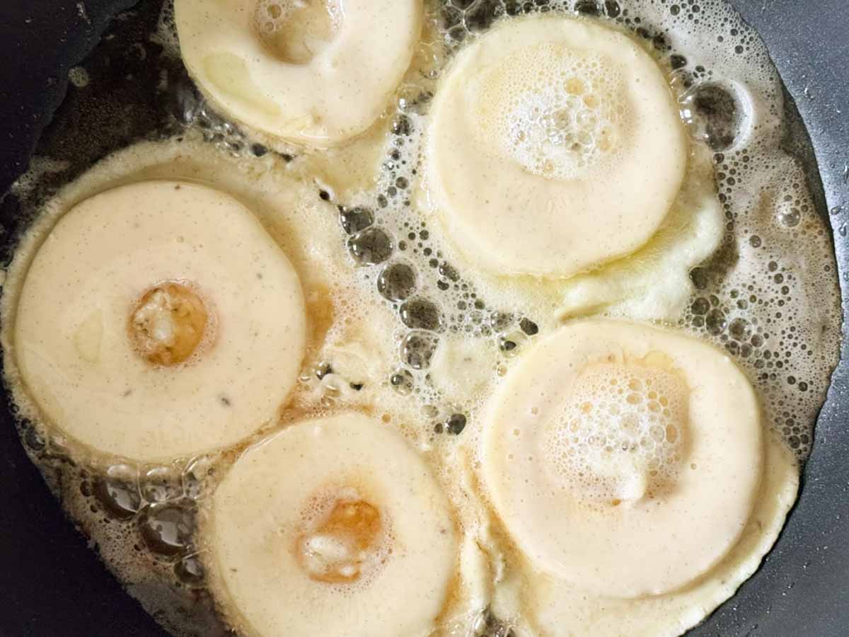 apple sliced being baked in pan