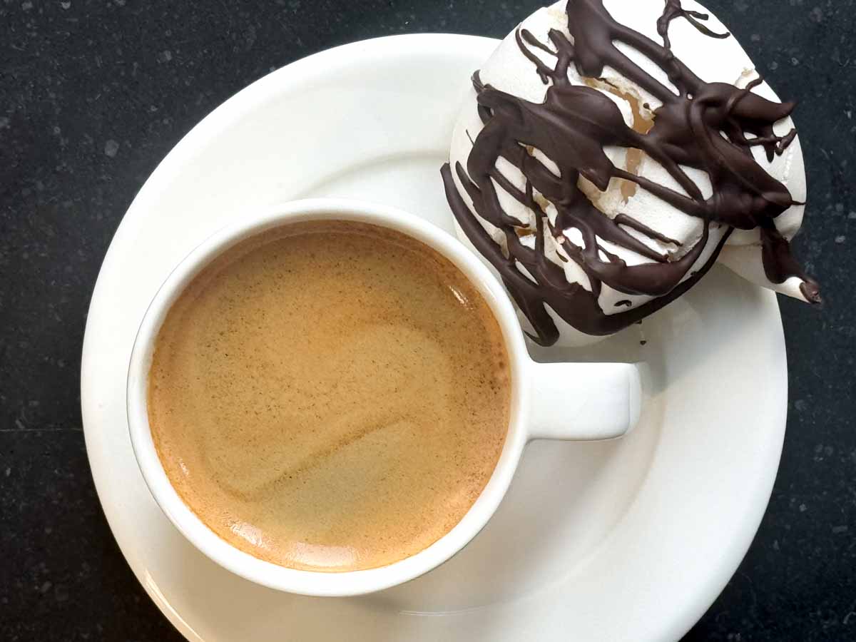 suspiros with chocolate and an espresso