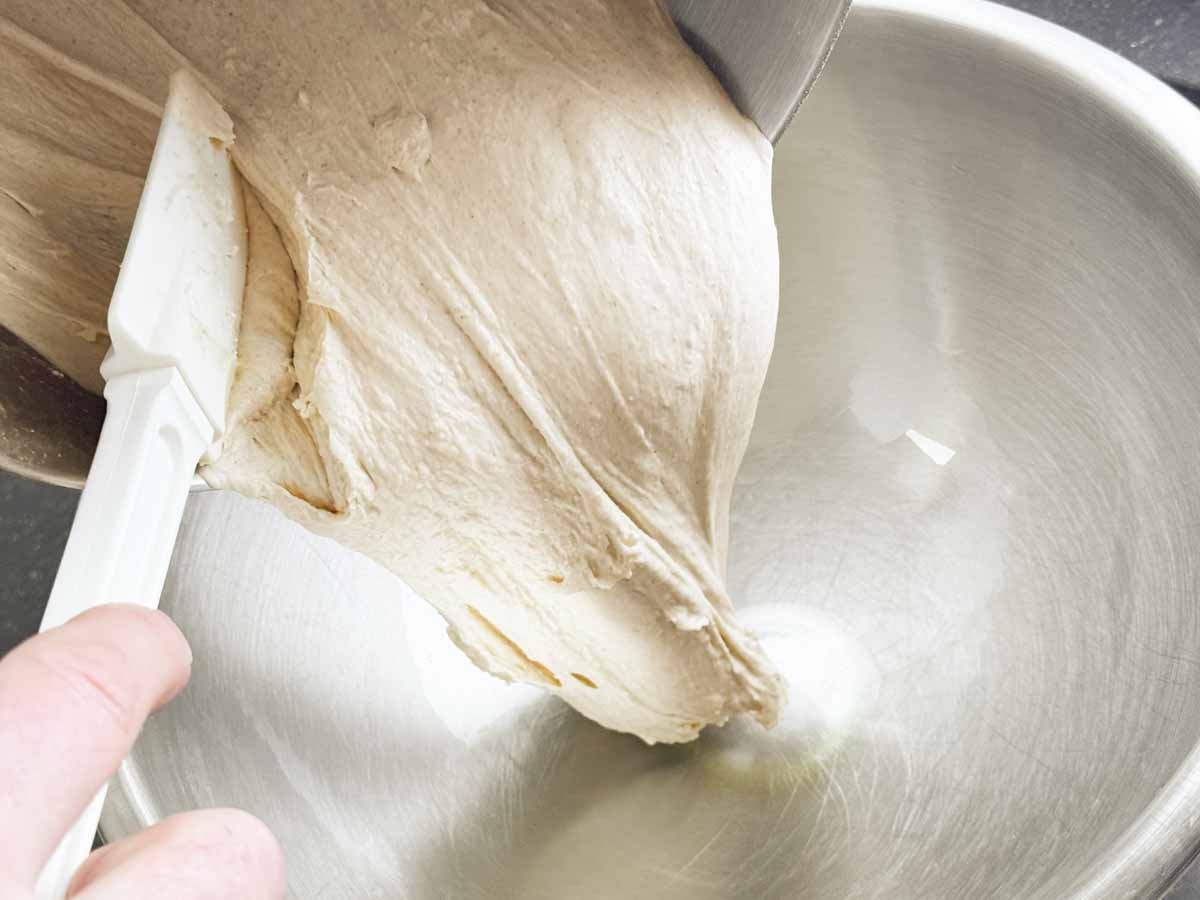 Pinsa Romana dough being poured into a bowl